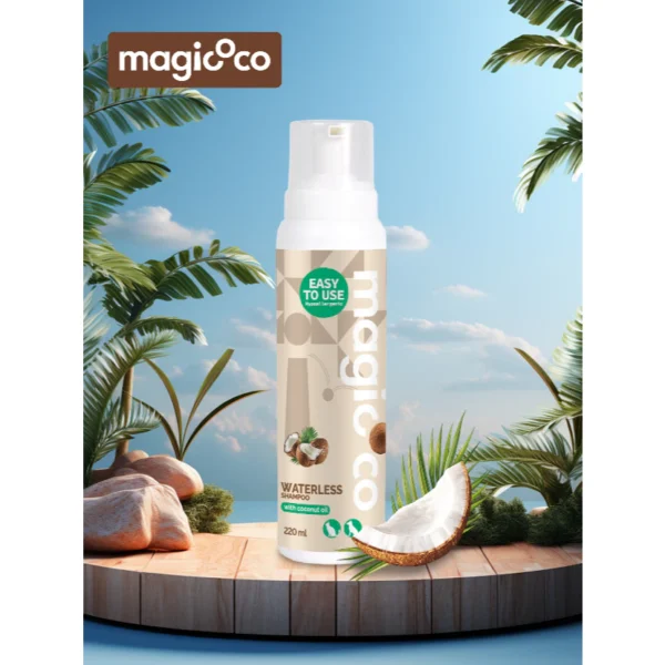 Product image of the magicoco Waterless Shampoo foam bottle (220 ml) set on a wooden deck in a simulated tropical environment with palm trees and a bright blue sky, emphasizing the coconut oil ingredient.