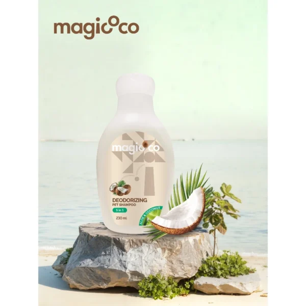 Close-up image of the white and green Magicoco 5-in-1 Deodorizing Pet Shampoo bottle (230ml) next to a slice of fresh coconut, highlighting the 'Aloe & Coconut' ingredients.