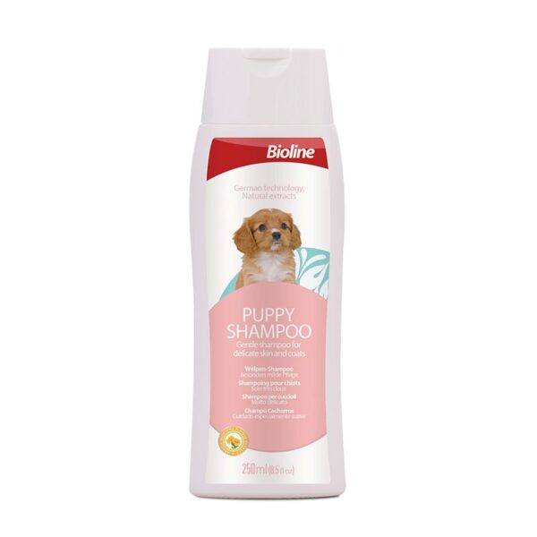 White plastic bottle of Bioline Puppy Shampoo, 250ml size, a gentle shampoo for delicate skin and coats, featuring an image of a small brown and white puppy on the label.