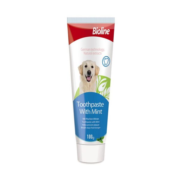 Front view of the Bioline Toothpaste With Mint tube. The white tube has a red and blue label featuring a golden retriever, an image of a tooth, and text indicating it is 100g and helps prevent plaque.