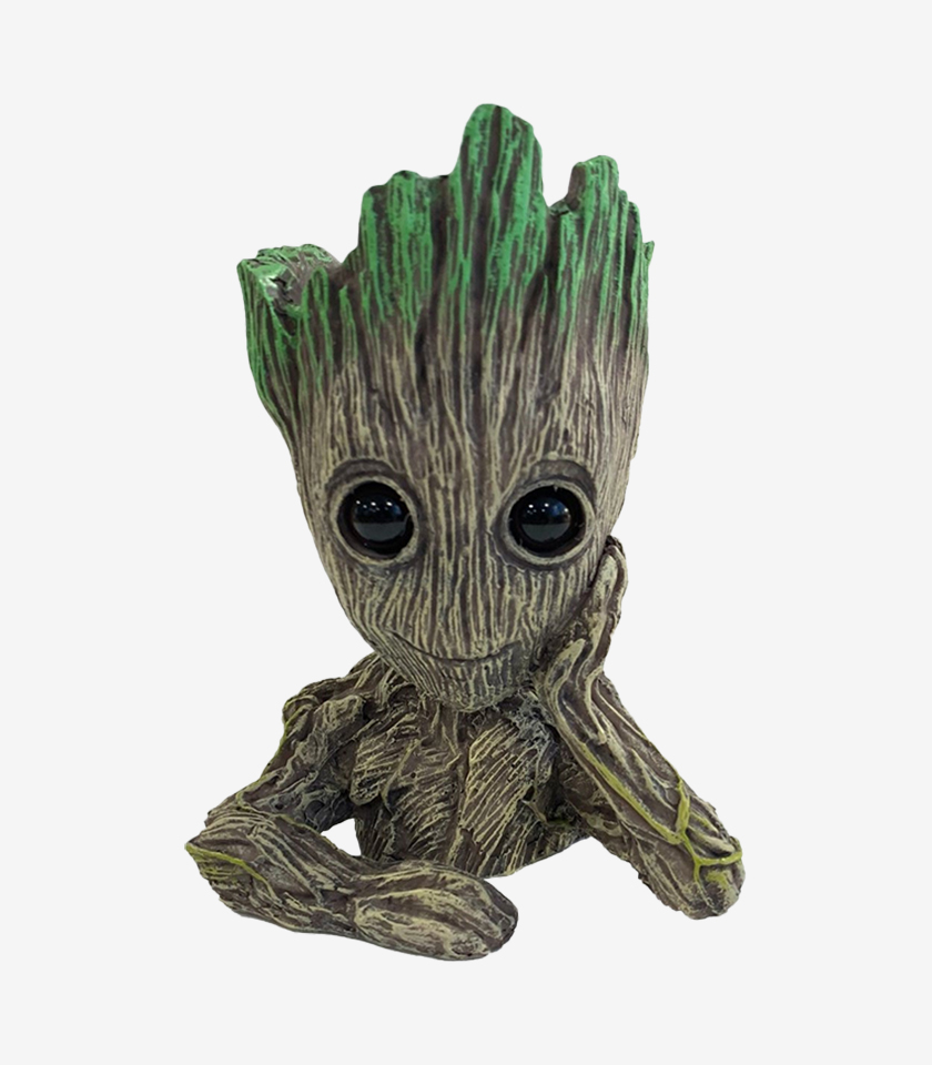 Groot aquarium ornament, a figurine of the Baby Groot character with a wood-like texture and green moss on its head.