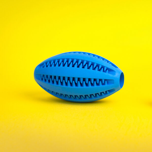Molar Sphere Rubber Dog Toy, a blue, elongated toy with rows of textured teeth and a hole at each end.