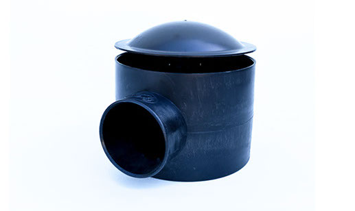 UltraZap 110mm Concrete Bottom Drain. Black cylindrical unit with a dome cap and a large side pipe connection.