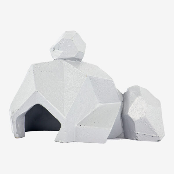 Animated Rock Stack aquarium ornament, a white geometric sculpture of an animal with a faceted texture and a cave underneath.
