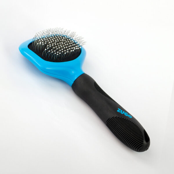 Slick Dog Brush, a blue and black dog brush with thin metal bristles that has a black textured handle with the word ZUGO in blue letters.