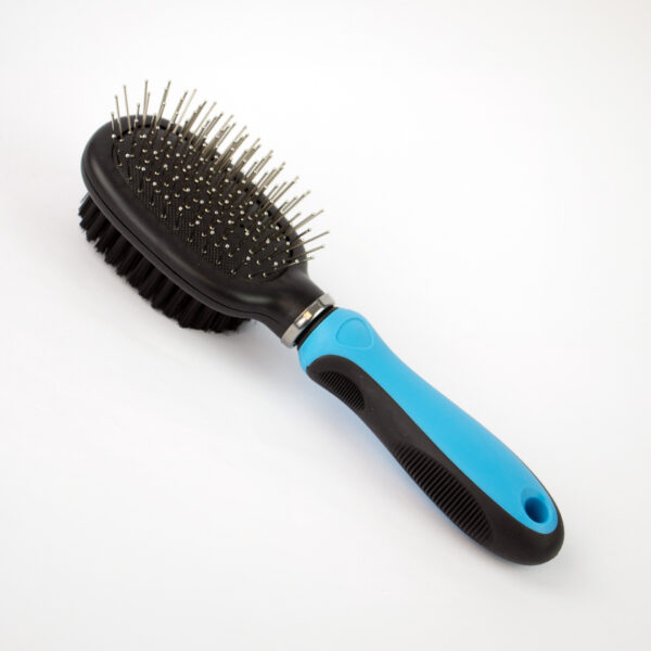 Multi Purpose Dog Brush, a dual-sided dog brush that has a pin side and a bristle side, with a blue and black handle.