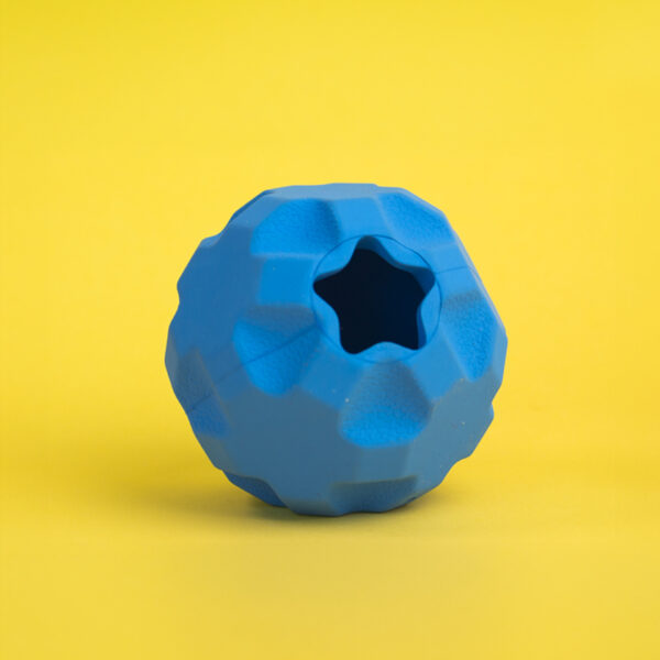 Treat Tumbler Rubber Dog Toy, a blue, spherical toy with a textured, faceted surface and a star-shaped hole.