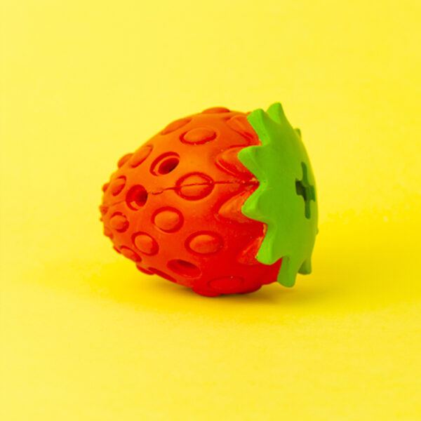 Zuberry Rubber Dog Toy, a red, berry-shaped toy with a bumpy, textured surface and a green leaf top.