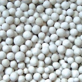 Oceanmax Bio Balls Filter Media, a close-up image showing a large quantity of small, white, spherical ceramic balls, which are highly porous and used for biological filtration in aquariums and ponds.