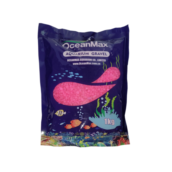 Oceanmax Pink Gravel Fish Tank Substrate Stones (Retail Bag), a dark blue plastic bag containing 1kg of smooth, highly polished pink artificial gravel, with graphics of fish and aquatic plants, and the product name OceanMax Aquarium Gravel.