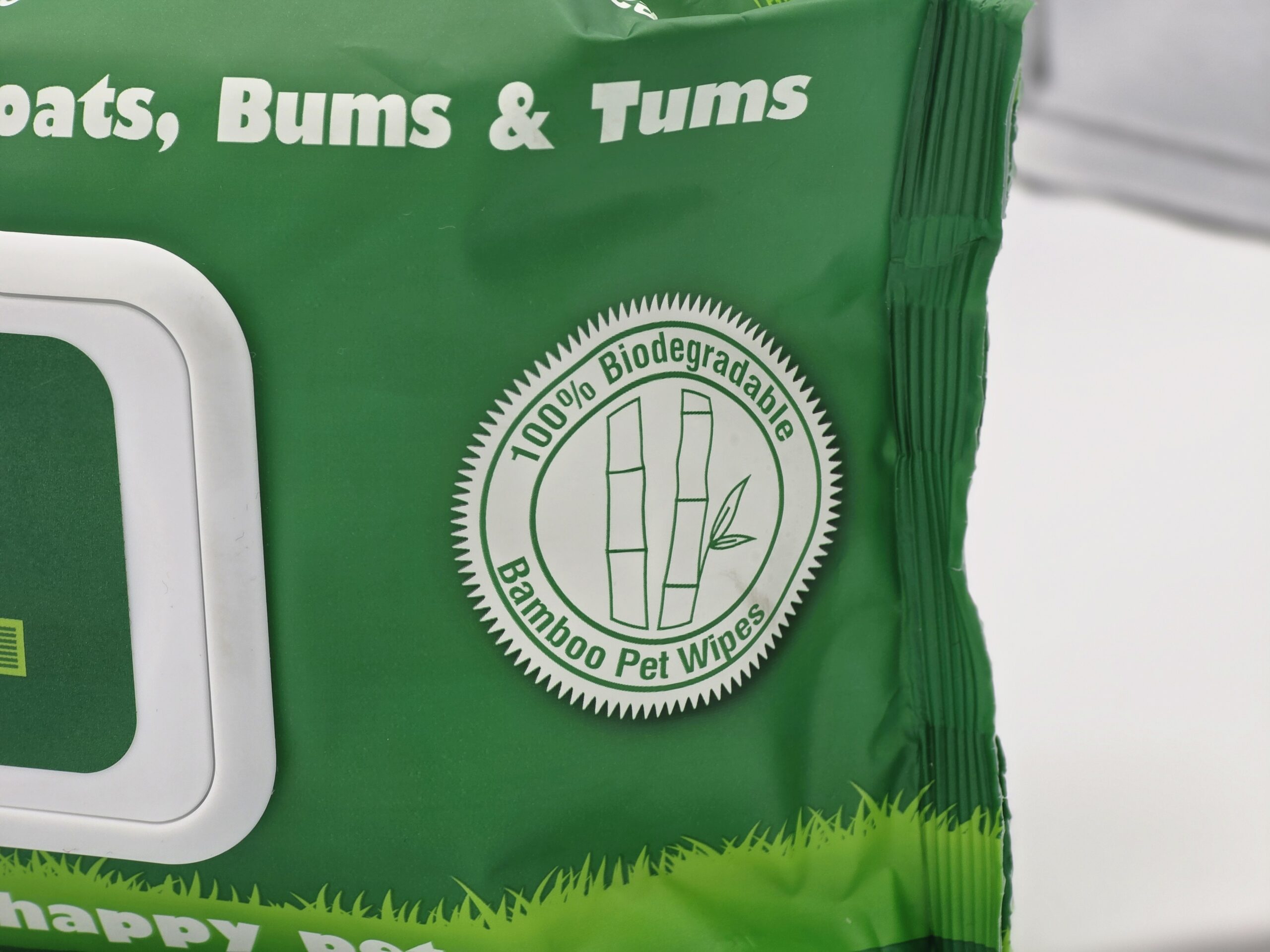 My Turf Pet Wipes 100% Biodegradable Bamboo Logo, a close-up of the green retail packaging showing a circular white and green logo with bamboo stalks, claiming "100% Biodegradable Bamboo Pet Wipes."