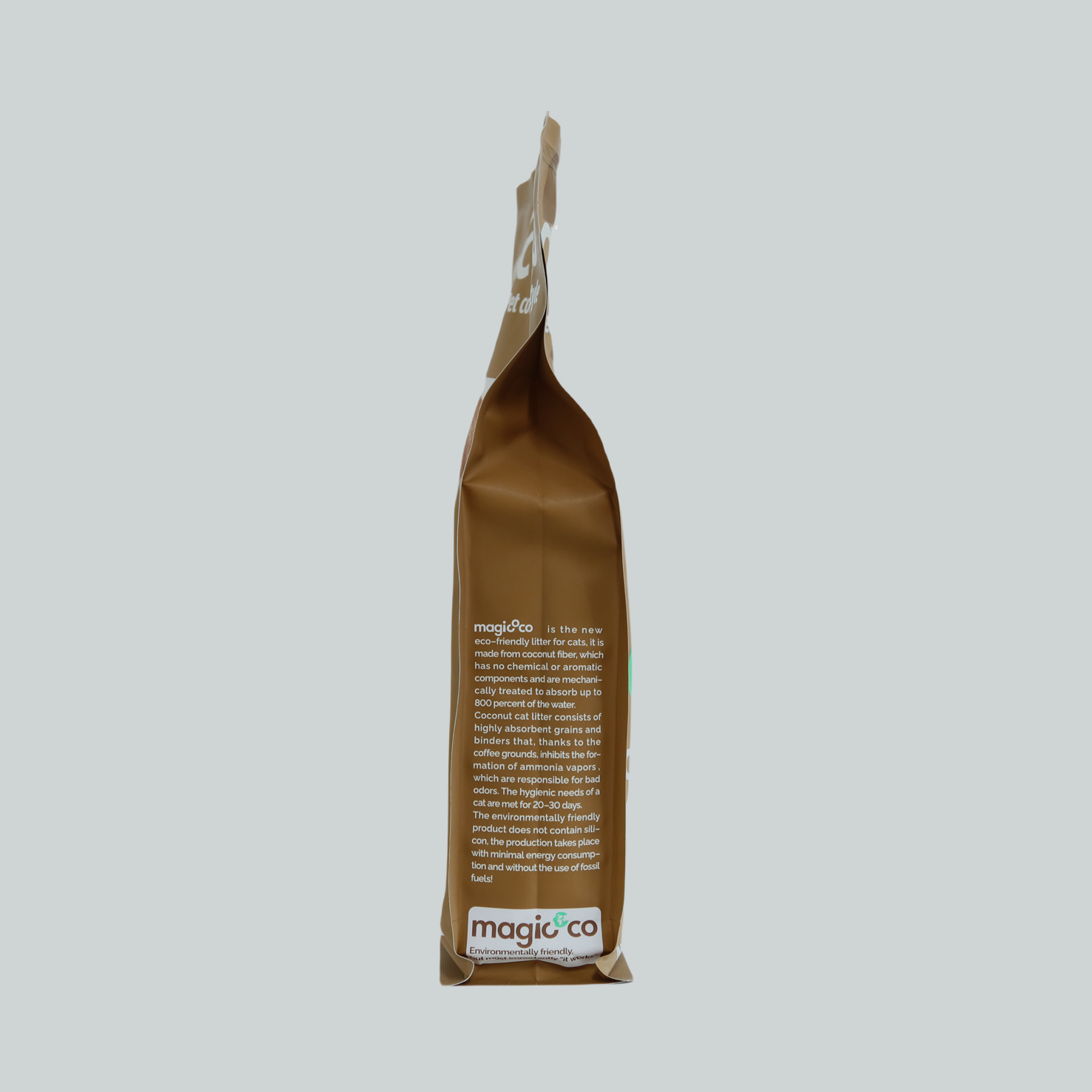 Side of the Magicoco Coconut Cat Litter bag with product description text. The text highlights that the litter is new eco-friendly, has no chemicals or aromatic agents, is naturally treated to absorb, consists of coconut coir and coffee grounds, and is environmentally friendly.